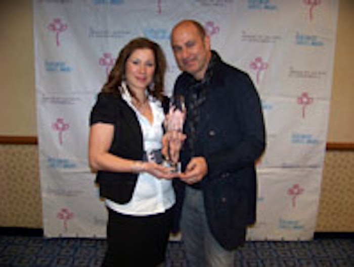 Angela Kohut (secretary, ASP; Atlantis Aromatics) and Legends Award recipient John Varvatos at the ASP Fragrance Symposium.