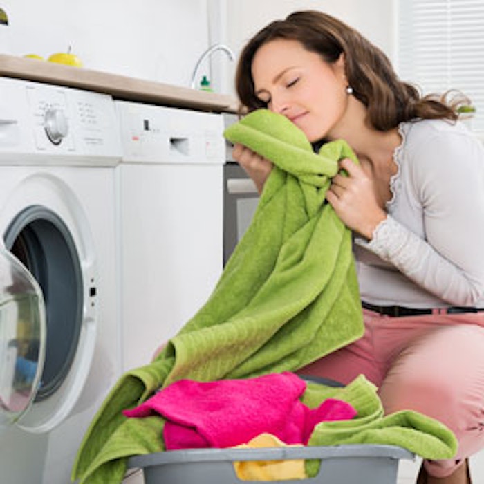 Woman-smelling-clean-laundry-300