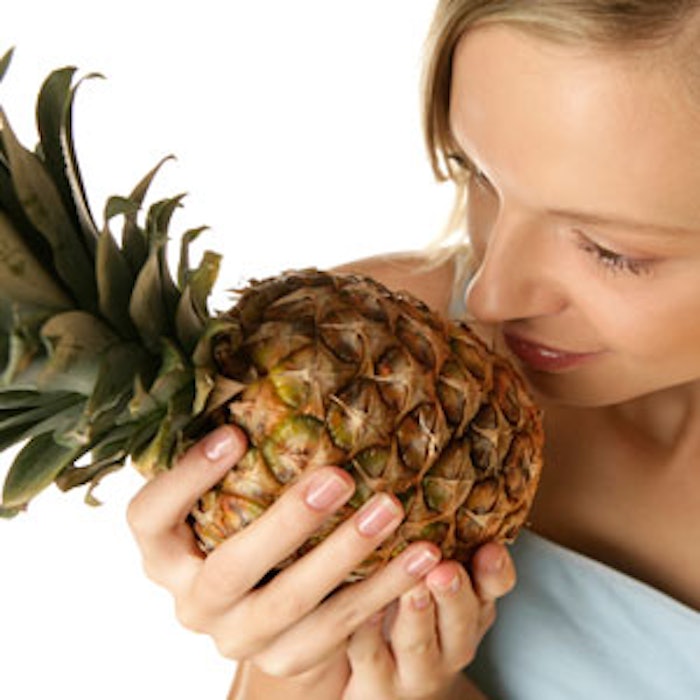Woman-smelling-pineapple-300