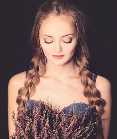 A woman smelling flowers