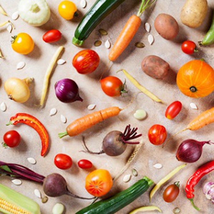 Natural food on kitchen table. Autumn vegetables and crop top view.