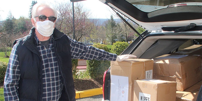 Norman Worth, Board Member of Atlantic Health with donated sanitizing supplies.