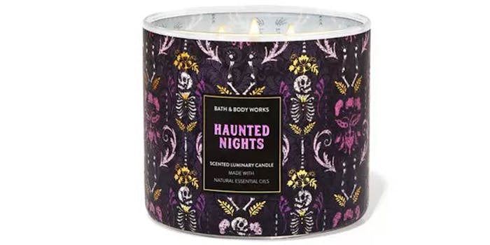 Haunted Nights Three-Wick Candle, with forest-like notes of sage, mahogany and verbena.
