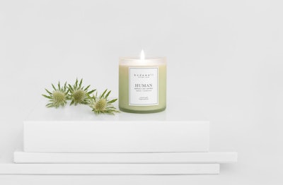 Human is described as 'like standing at the top of a mountain, overlooking the expanse of green around you. breathing deeply into the sharp scent of balsam and the familiar and welcoming touch of sandalwood.'