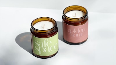 The Safe Space candle offers notes of white tea, thyme, jasmin, and bergamot. This candle also comes with green branding to symbolize mental health awareness.