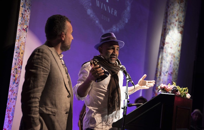 Oswaldo Macia accepts Sadakichi Award with Ricardo Moya in 2018.