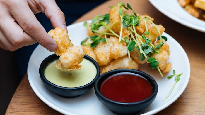 The report cites that dips and sauces encourage approachable international flavor trial.