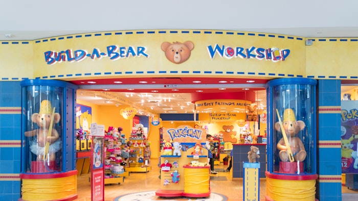The 16-inch teddy bear shows off pumpkin orange-colored fur, sparkly gold paws and ears and a scent to match.