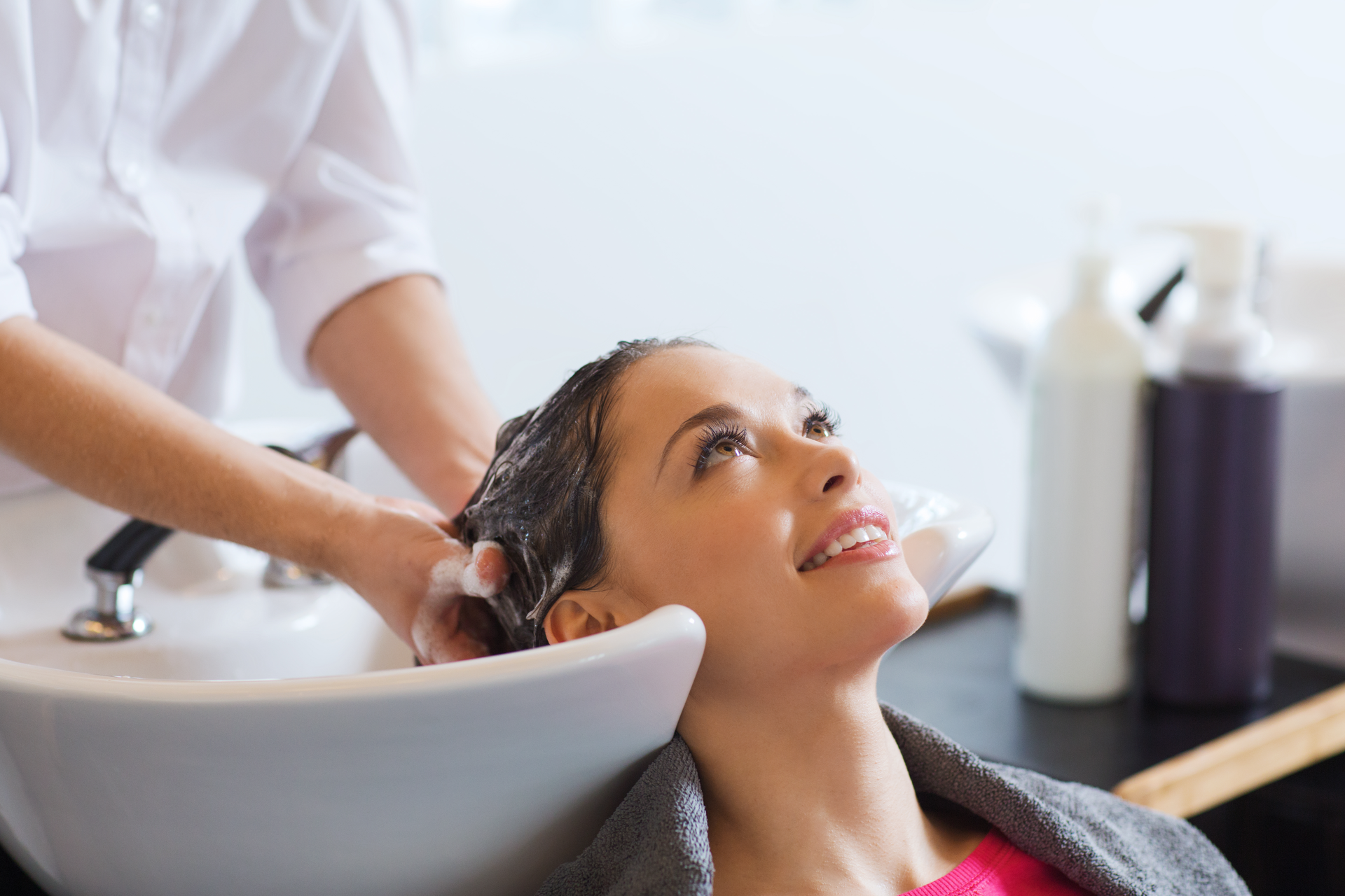 Happy client getting her hair done at a hair salon