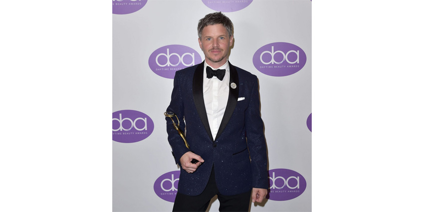 Ben Barkworth holding the Inventor&rsquo;s Award at this year&rsquo;s Daytime Beauty Awards (DBA).