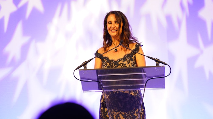 Firmenich's global president, Perfumery, Ilaria Resta accepted the Sustainability Award, presented by Deepak Chopra.