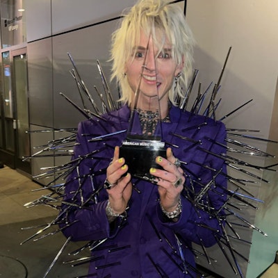 Yellow and black nail art on Machine Gun Kelly