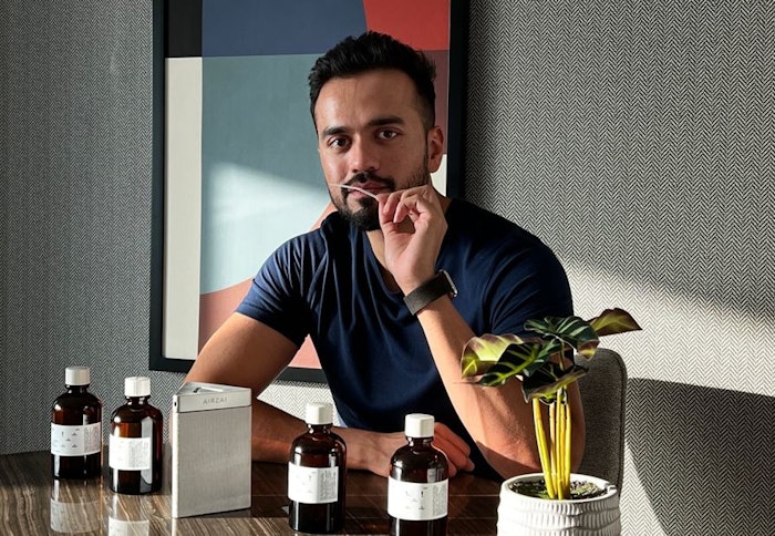 Airzai CEO, Airzai Muneeb Mushtaq, testing Firmenich fragrances made for Airzai Aroma.