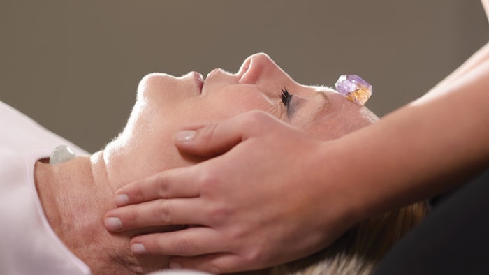 woman receiving reiki treatment