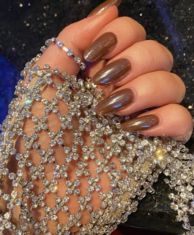 Dark chocolate brownie nails on Sabrina Carpenter