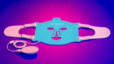 higherdose light therapy face mask laying flat on a purple background