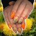 Get nail inspo for how to style your clients' nails this spring with these floral nail looks.