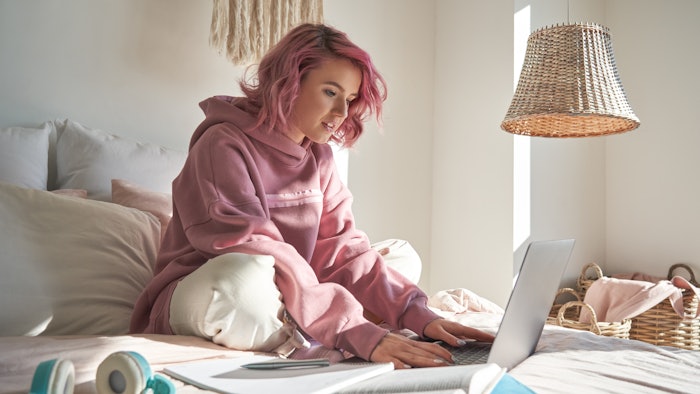 young girl at home using internet