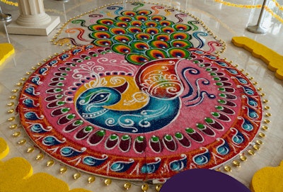 Indian tradition of drawing Rangoli in front of a home is a great source of inspiration. Rangoli is an art form that uses multi-color decorations drawn on the ground in front of a house.