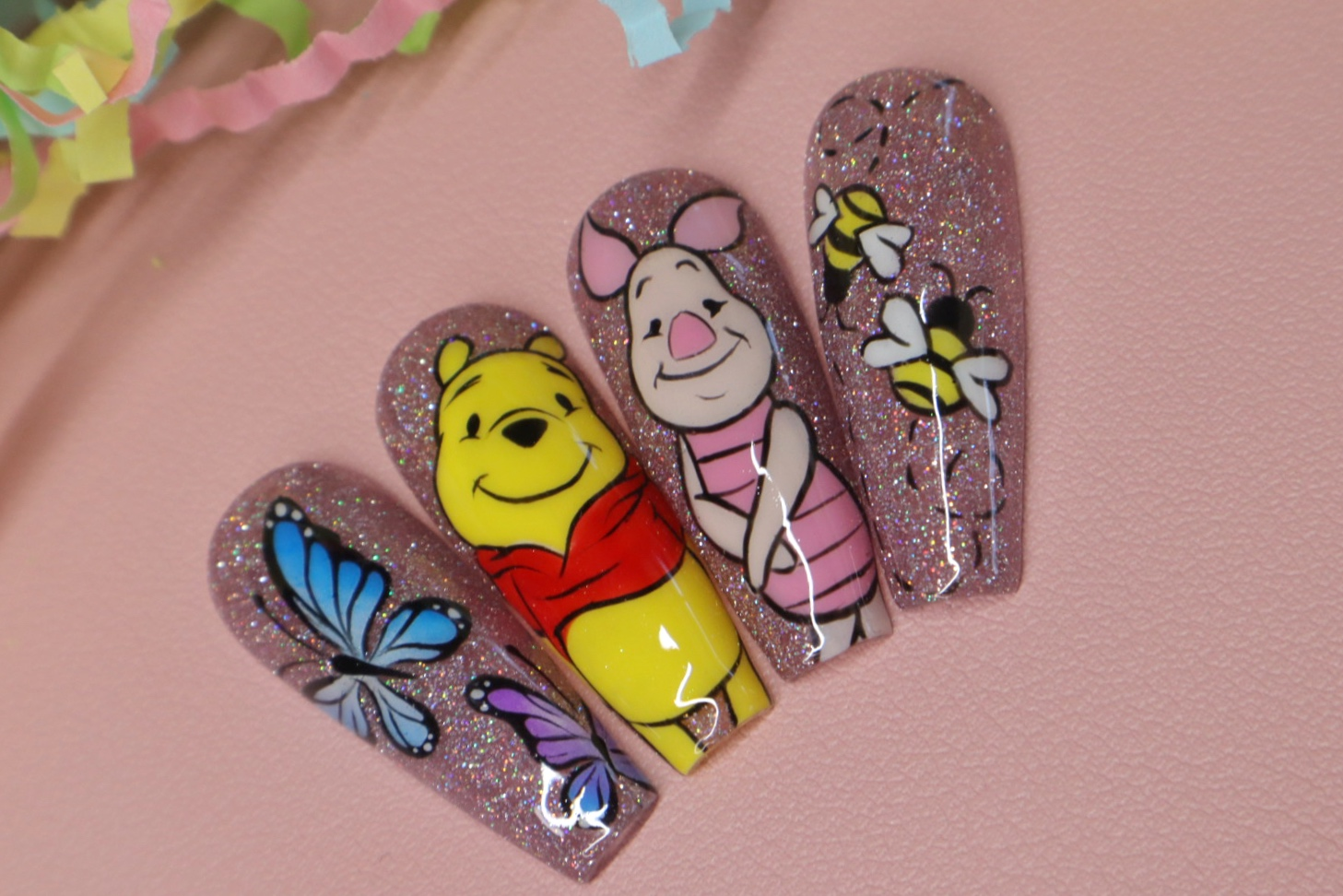 Winnie the Pooh and Piglet nail art featuring butterflies and bumblebees by @keepinittreal