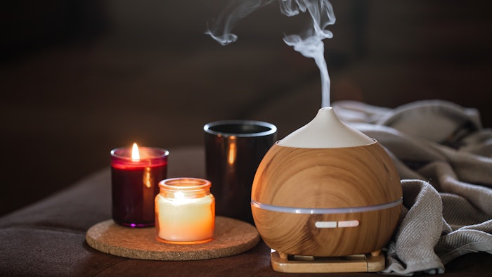 Modern oil aroma diffuser wiht decor details copy space