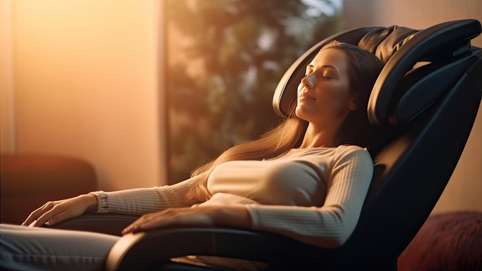 A woman relaxing on the massage chair