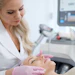 Woman getting treatment with aesthetic dermatology device