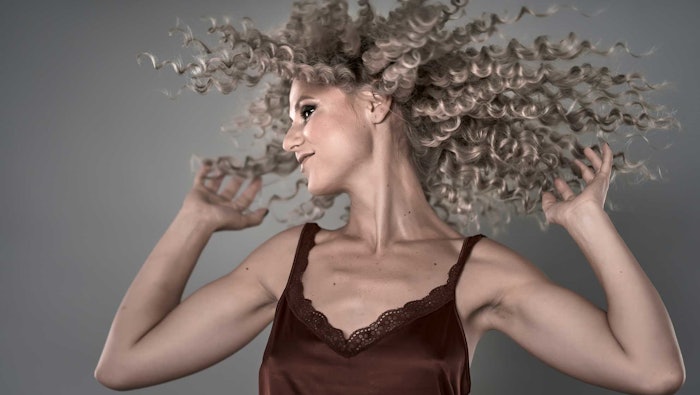Woman Curly Hair Flipping Ct2406 Expert Opinion Adobe Stock 387816547