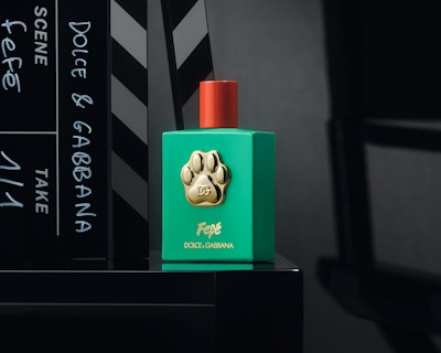 Dolce&Gabbana Fefé fragrance comes in a green lacquered glass bottle, decorated with a red metal cap and adorned with a 24k gold-plated paw at its center.