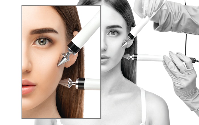 Woman with energy devices by her face in the spa
