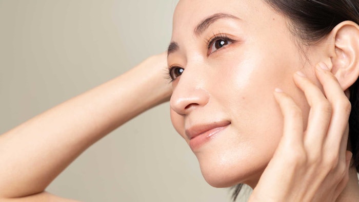 beautiful Asian woman with radiant glowing skin
