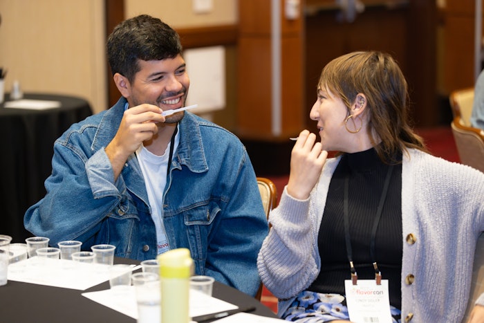 Speakers Francisco Clavero and Cindy Sigler, Ph.D. from NotCo enjoying the live pre-con organoleptic material panel.