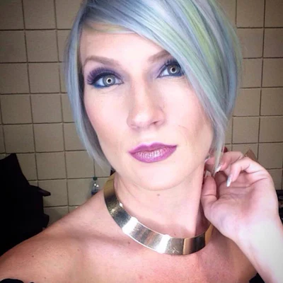 Model with lavender and mint green pastel hair in a bob.