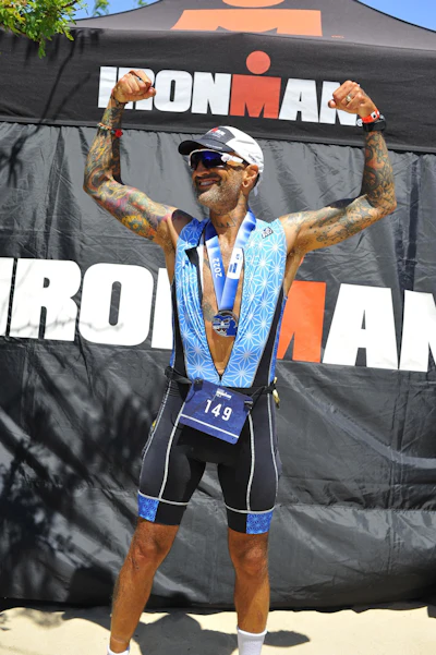 Ben Mollin finishing an Ironman