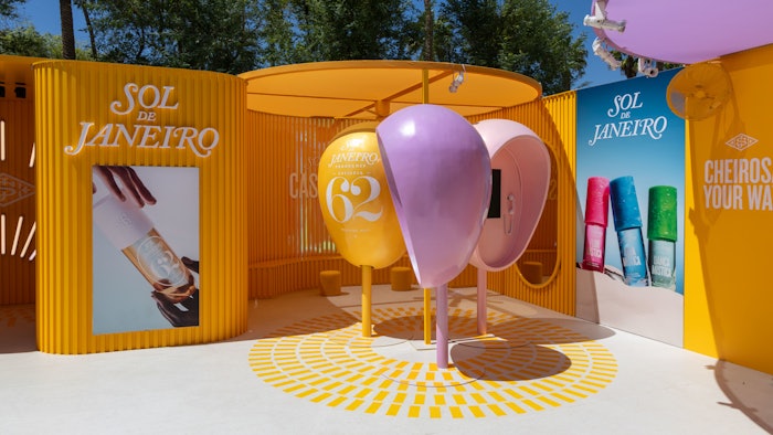 The activation reimagines Rio’s orelhões, dome-shaped public phone booths, as colorful scent portals covered in original artwork.