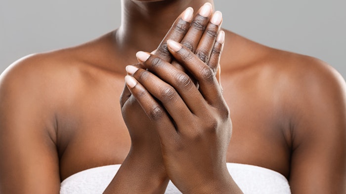 Black Woman Hands Rubbing Natural Nails Adobe Stock 305714509