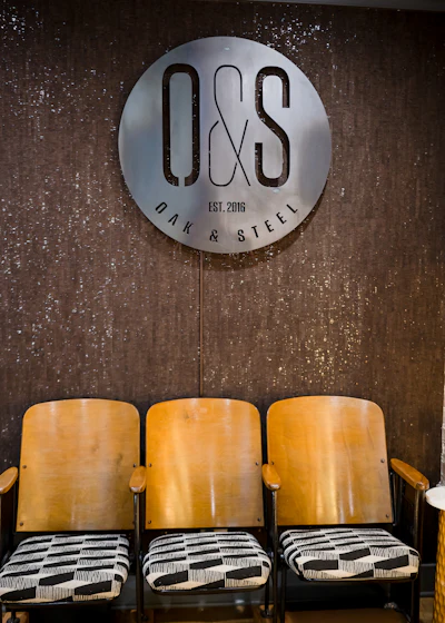 'The lower level, the barbershop, has a mix of colors that you would find in nature, with some wood, metals and sprinkles of brick that we found in our demolition of the space. There are five classic barber chairs and vintage theater seats for waiting.'