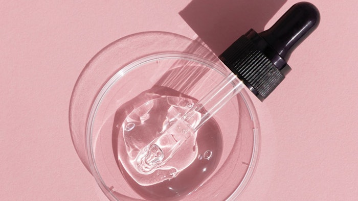 Pink Background Dropper On Glass Disc Clear Liquid