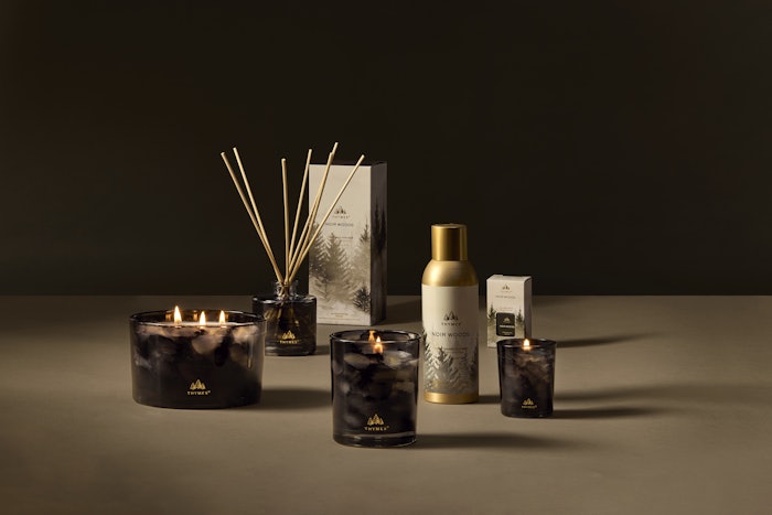 Noir Woods includes scent notes of golden amber, smoky woods and fresh evergreen.