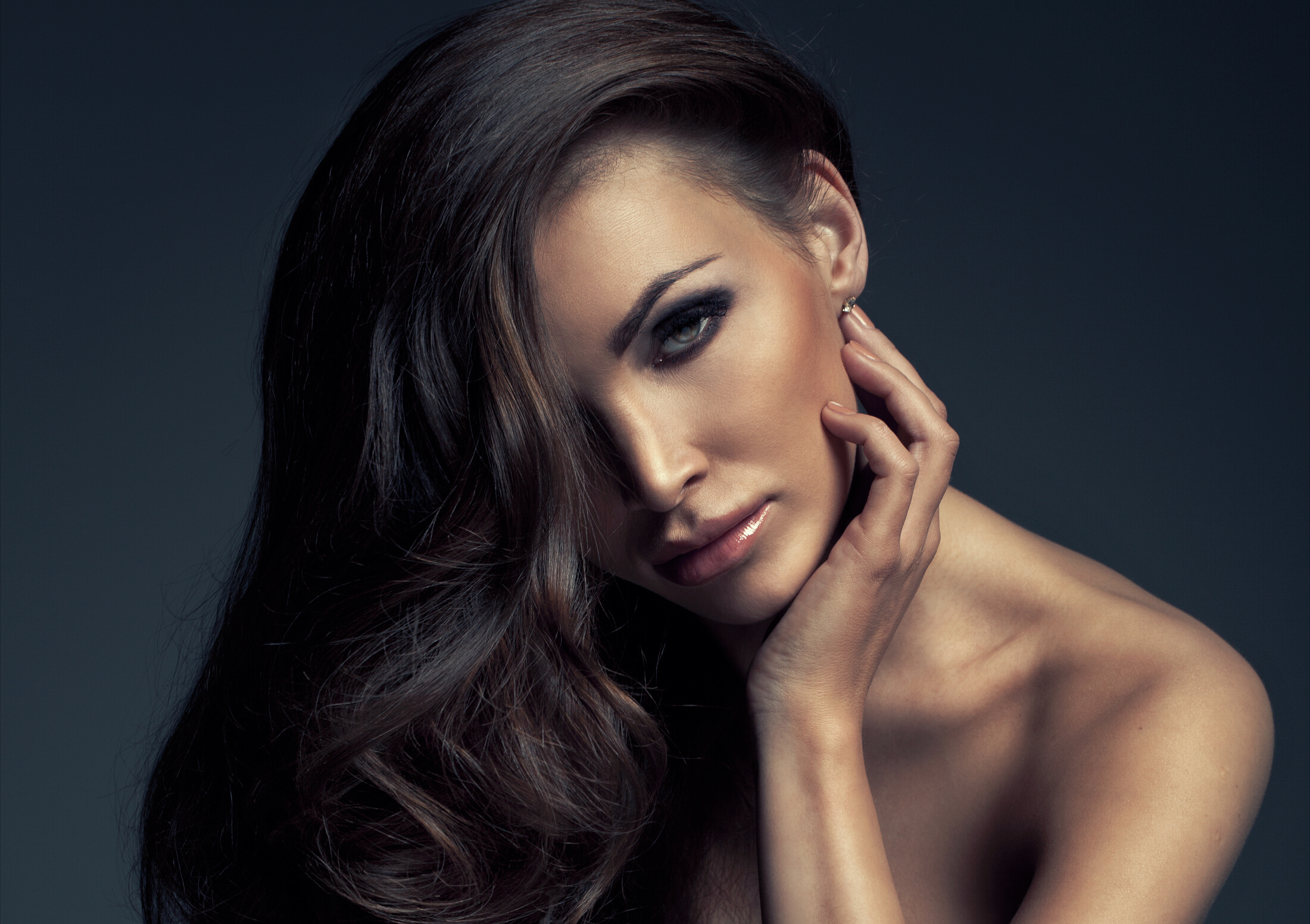 Brunette With Long Shiny Hair Leaning Over A Chair2