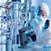 Scientist In Lab Near Bioreactor Inspecting Samples Adobe Stock 647855538