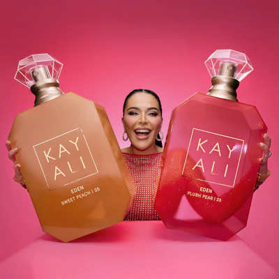 Kayali, founded by Mona Kattan, recently expanded its Eden Collection with Sweet Peach | 35 and Plush Pear | 23, utilizing vibrant lacquered glass bottles inspired by traditional Middle Eastern oud bottles.