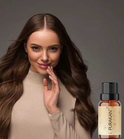 Woman with long dark hair touching her face next to Purakán essential oil bottle