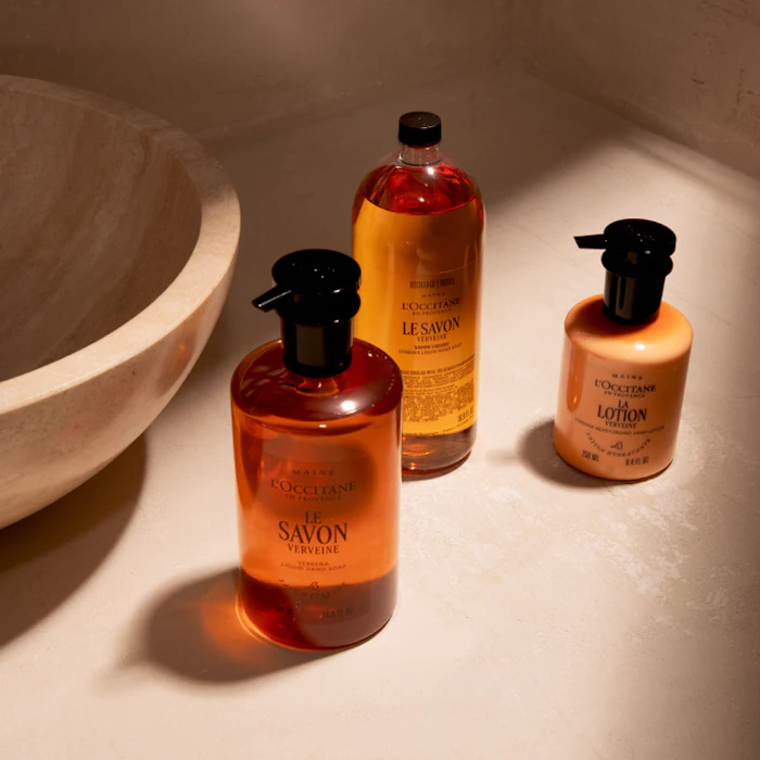 L'Occitane Verveine soap and lotion products displayed with ceramic bowl in natural sunlight
