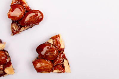 Sliced red bell peppers with seeds and white flesh displayed on neutral background