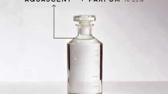 Clear glass perfume bottle labeled Aquascent with Parfum 10-25% concentration on white background