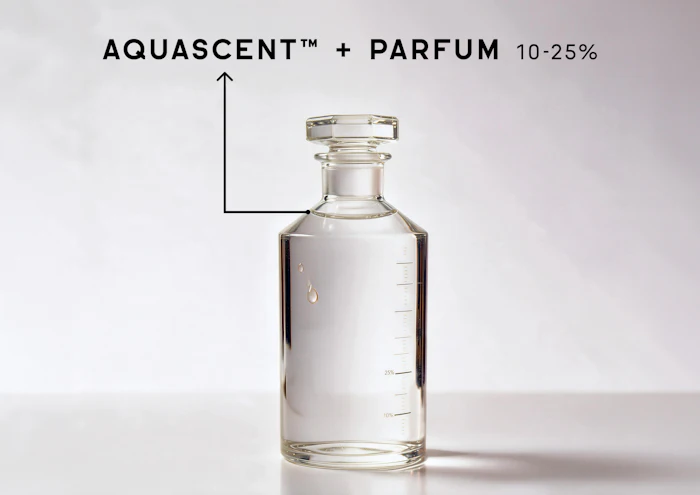 Clear glass perfume bottle labeled Aquascent with Parfum 10-25% concentration on white background