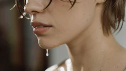 Fresh eccrine sweat is largely odorless. Characteristic axillary odor emerges when microorganisms on the skin metabolize precursors secreted by the body, generating volatile compounds with substantially different odor characteristics.
