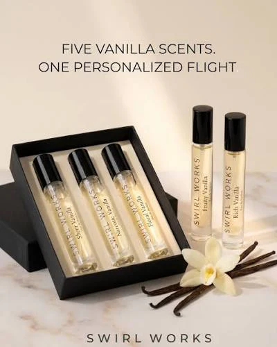 Swirl Works vanilla fragrance set with five personalized scent bottles in black gift box and two spray bottles displayed with vanilla pods