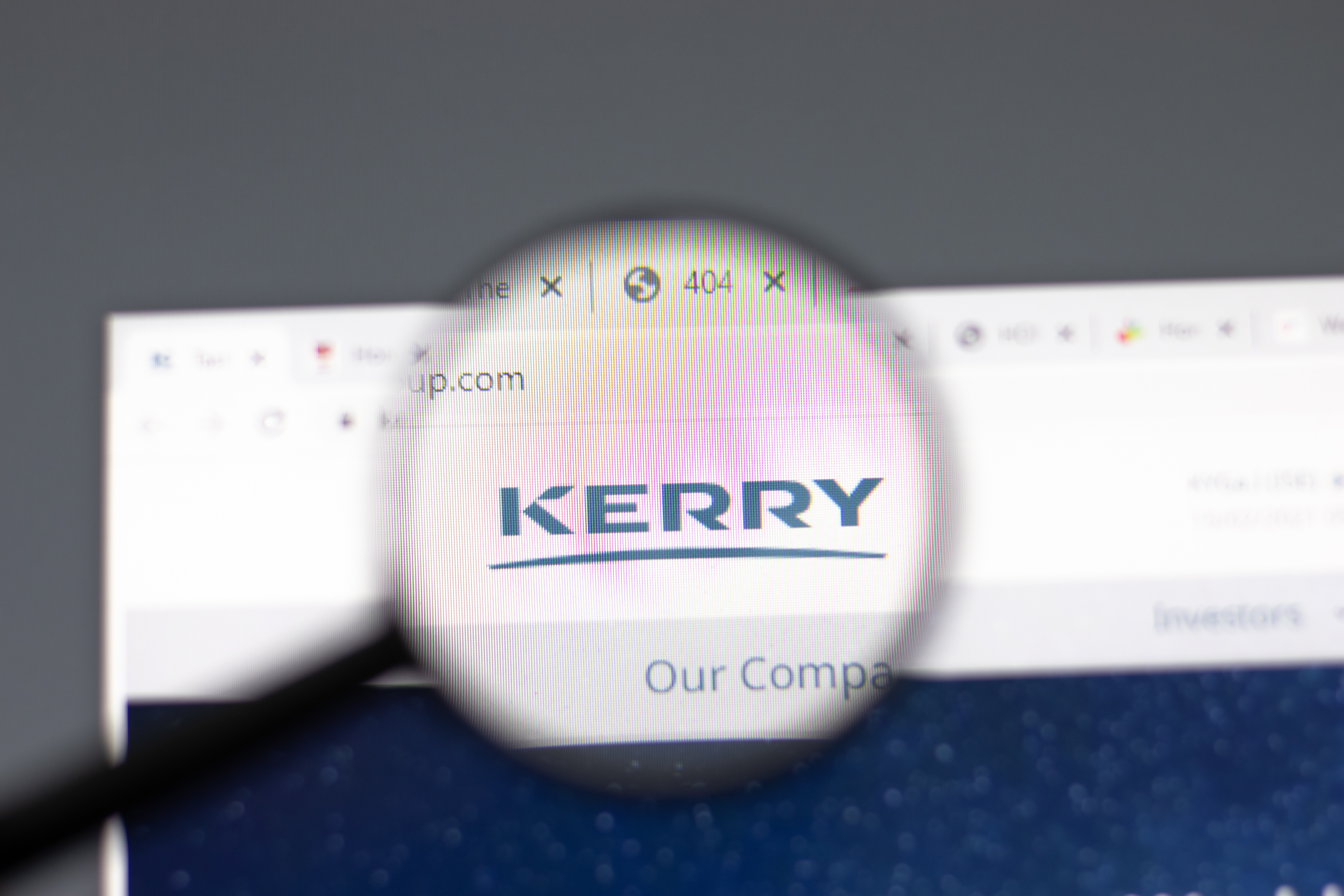 Kerry company logo displayed on 404 error page viewed through magnifying glass